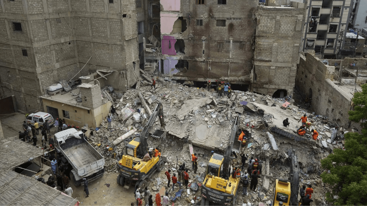 Pakistan building collapse: 12 dead, 20 feared trapped; commissioner says it's residents' fault